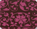 A close-up of the FLORAL SCROLL RASPBERRY pattern.