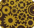 A brown and yellow GEARS mousepad with gears on it.