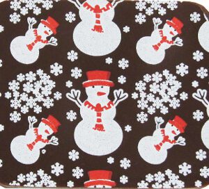 A SNOWMAN RED/WHITE 10" X 16" coaster with snowflakes on it.