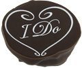 A chocolate heart with the I DO WHITE COOKIE TRANSFER on it.