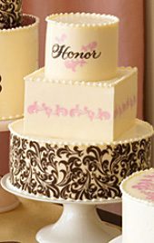 718 A group of wedding cakes with the word honor on them.