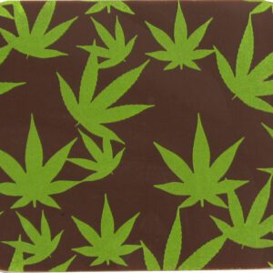 A brown and green coaster with marijuana leaves on it. The MARY JANE coaster in CHARTREUSE color and measuring 10" x 11".