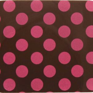 A pink polka dot coaster with a brown background.
