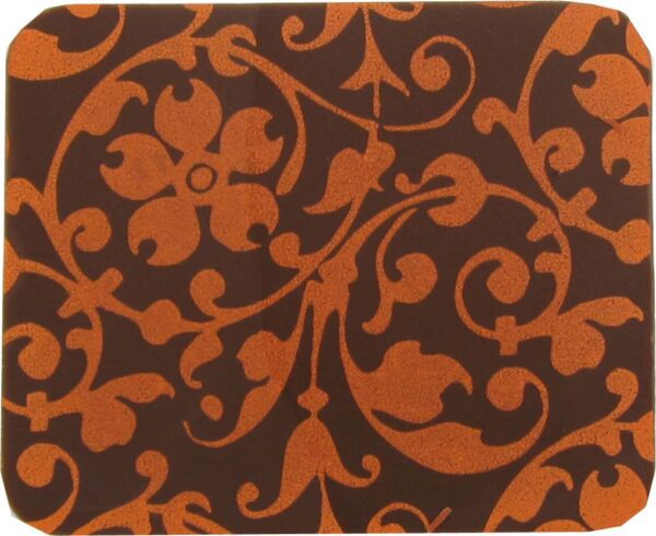 An orange and brown coaster with a floral pattern.