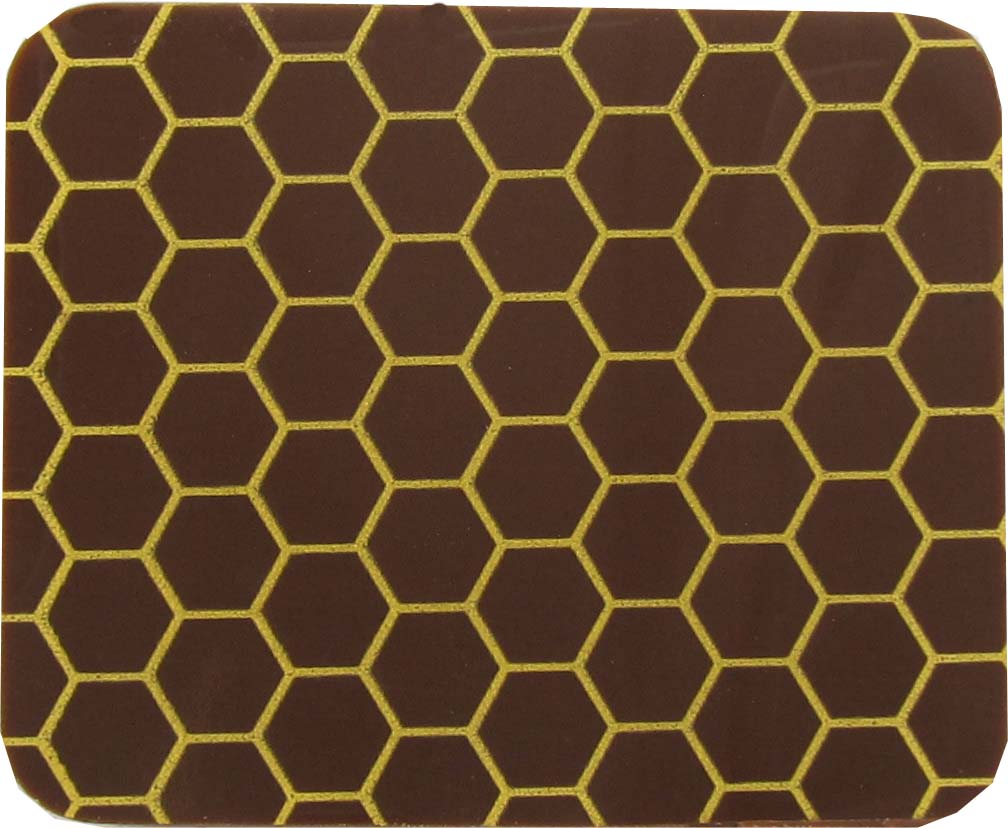 A brown and yellow coaster with a honeycomb pattern.