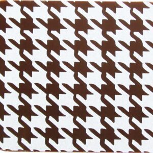 A brown and white houndstooth coaster.