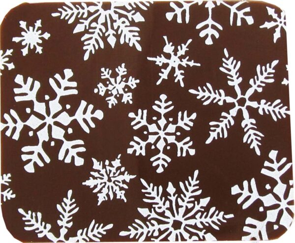 A brown and white snowflake coaster with white snowflakes.