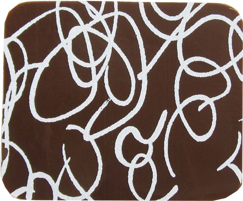 A chocolate coaster with a white and brown design.