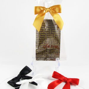 A black, white, and gold bow tied around a gift bag.