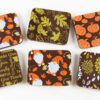 A set of coasters with autumn leaves and gnomes.