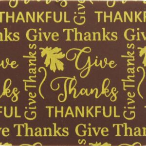 A brown and gold coaster with the words Give Thanks thanksgiving.