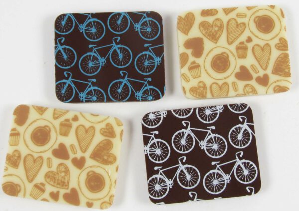 Four coasters with bicycles and hearts on them.