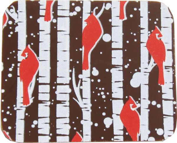 A brown coaster with red and white cardinals and birch trees.