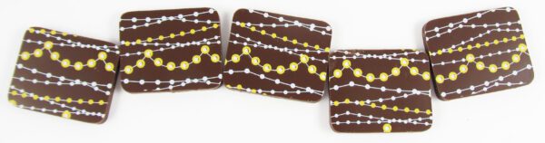 Four chocolate bars with yellow and brown stripes on them.