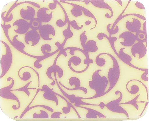 A square soap with a purple and white design.