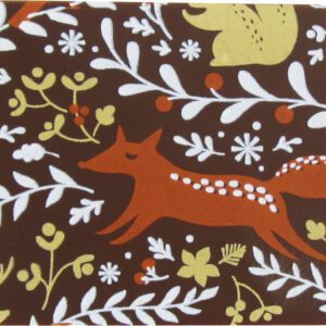 A brown coaster with foxes and flowers on it.