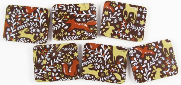 A set of Fox & the Forest WH/OrangeSpice/Khaki 10" x 11" coasters with foxes and flowers on them.