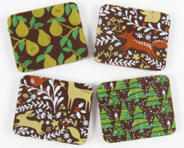 Four coasters with a brown and green pattern.