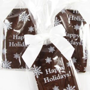 Three chocolate bars with happy holidays written on them.