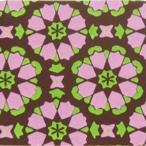 A pink and green coaster with a floral pattern.