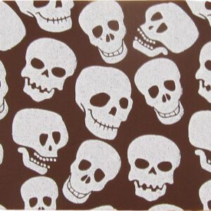 A brown coaster with white skulls on it.