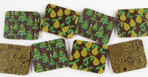 A set of Pears coasters with leaves on them.