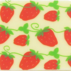 A strawberry shaped coaster with green and white stripes.