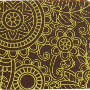 A brown and yellow coaster with a floral pattern.