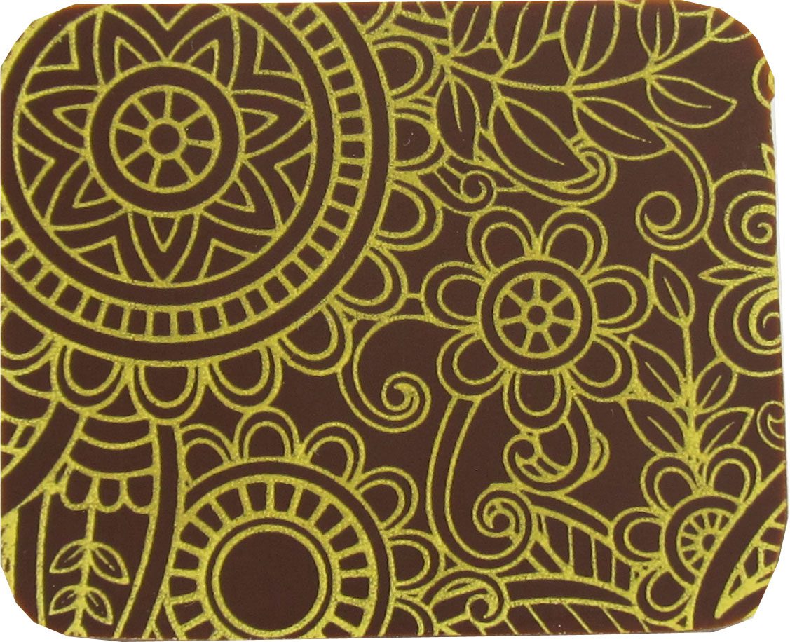 A brown and yellow coaster with a floral pattern.