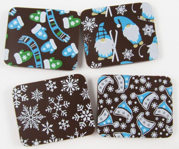 Four coasters with snowflakes and gnomes on them.