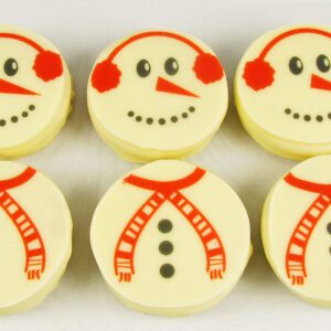 Six snowmen are sitting on a white surface.