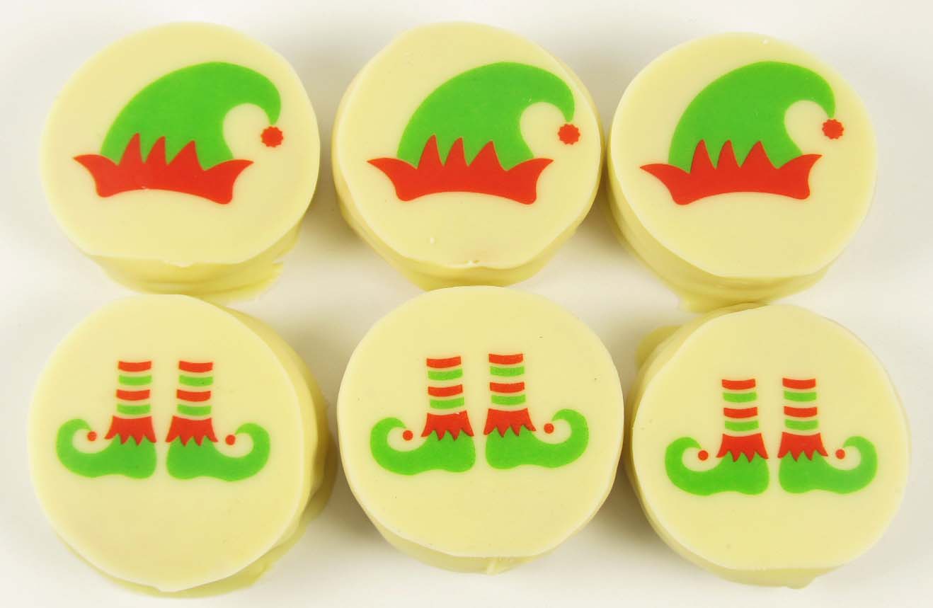 Round white chocolates decorated with elf motifs